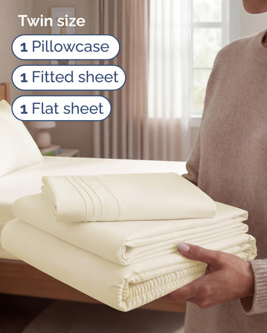 CGK Unlimited fitted sheet off-white 75x38 on bed with deep pockets