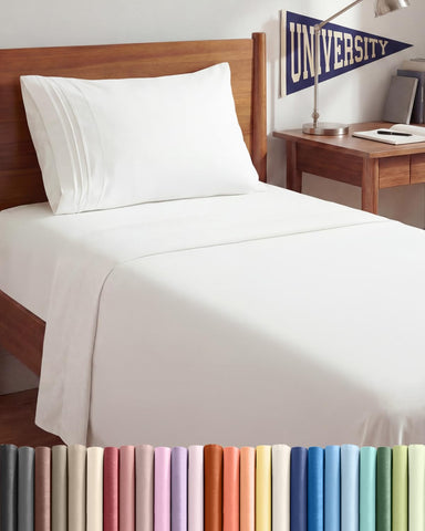 CGK Unlimited twin-xl 3-piece set folded in antique white for cozy nights.