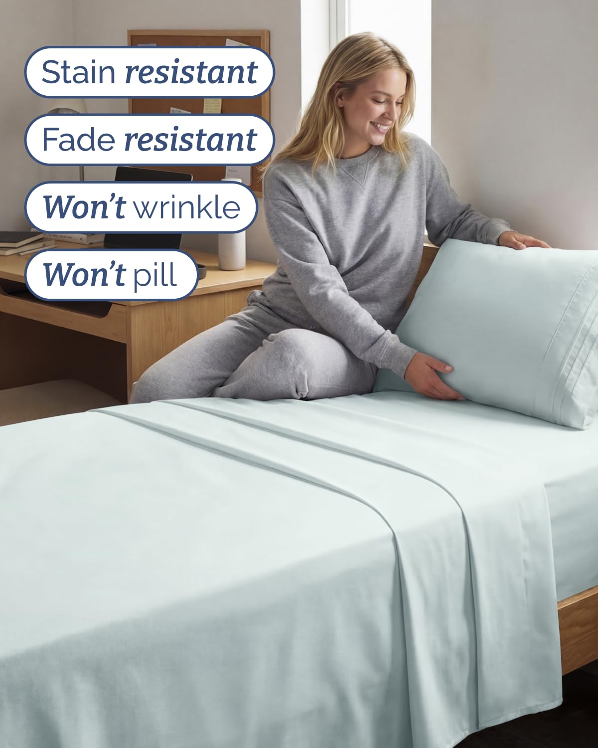 CGK Unlimited bed display with ice blue sheets for hotel-like luxury.