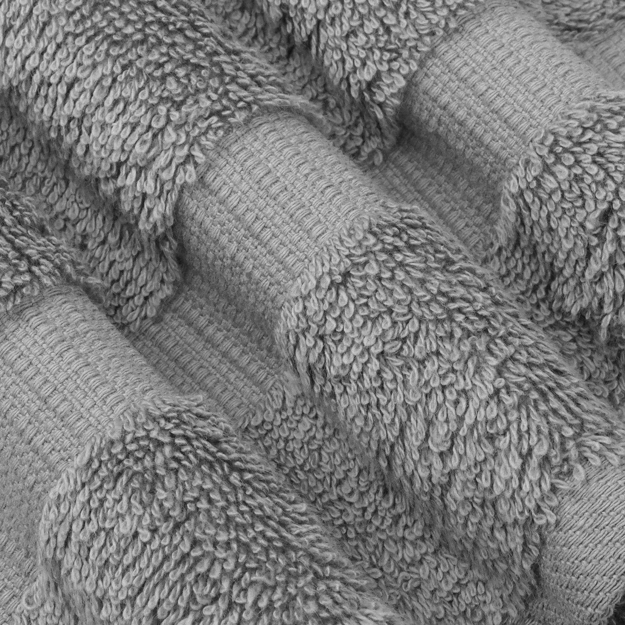 Denizli craftsmanship highlighted on Chakir Turkish Linens towels in gray.