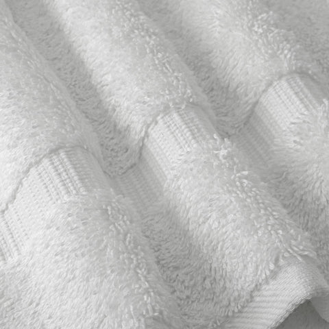 Chakir Turkish Linens hotel spa-inspired bath scene features premium towels in use.