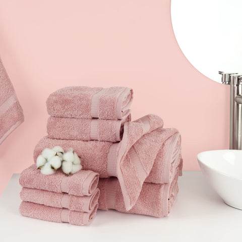 Chakir Turkish Linens pink hand towels closeup showing durable double-stitched hems.