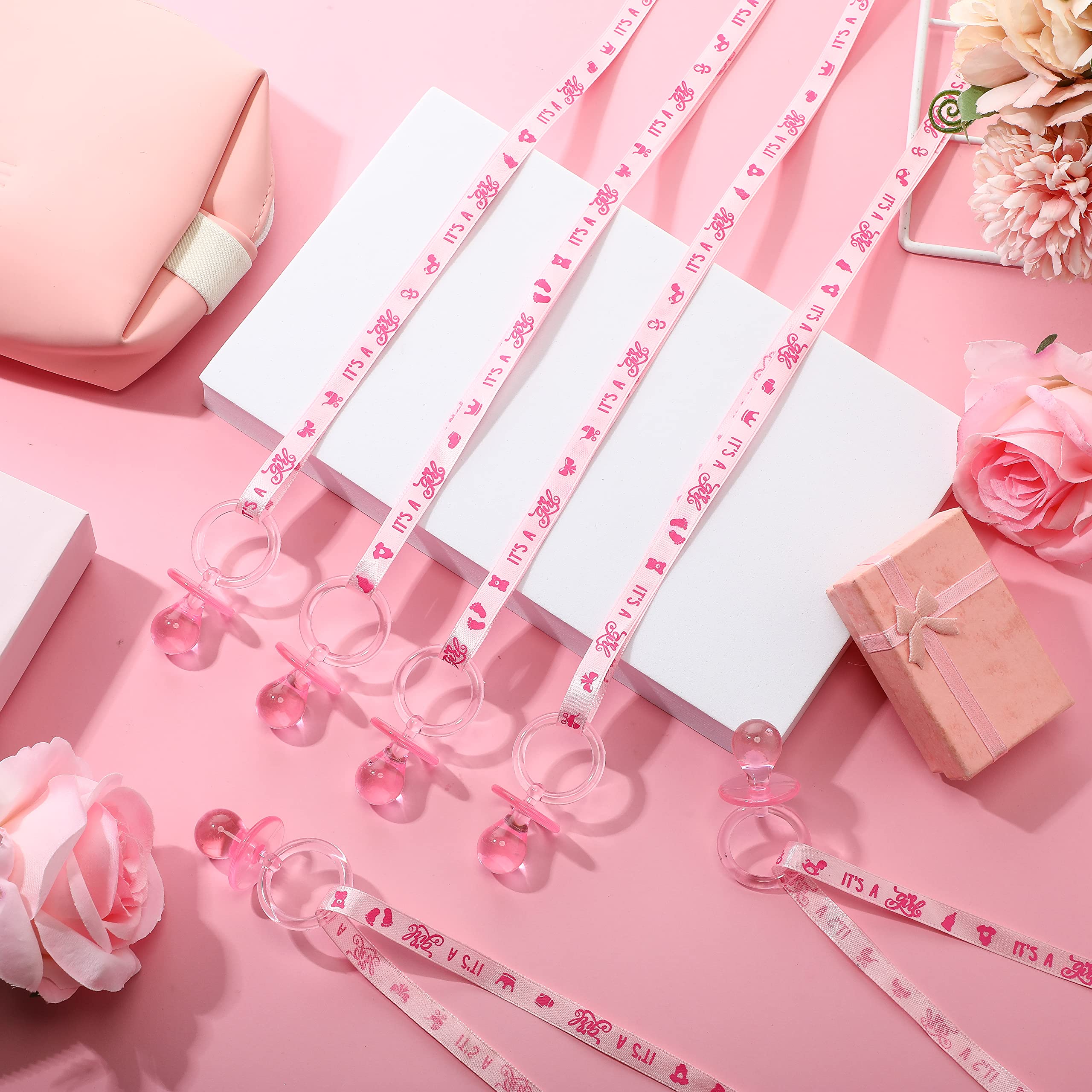 CHENGU pacifier necklace decor on table-scatter for baby shower ambiance.