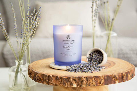 Chesapeake Bay Candle Serenity Calm wick self-trimming feature visible in action.