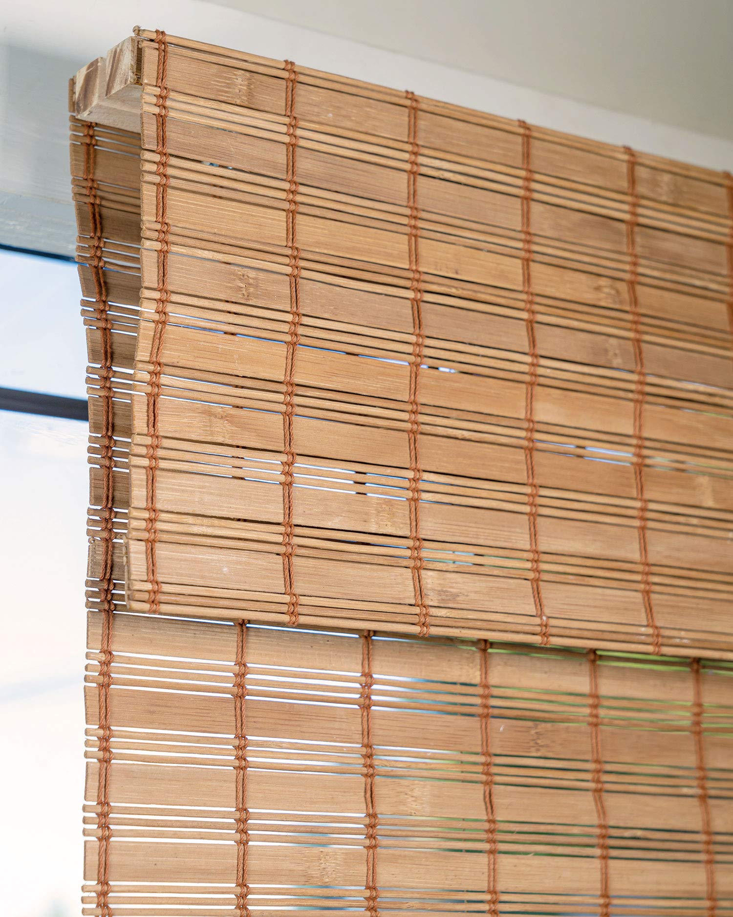 CHICOLOGY Bamboo Roman Shade natural-bamboo texture adds organic warmth to interiors.