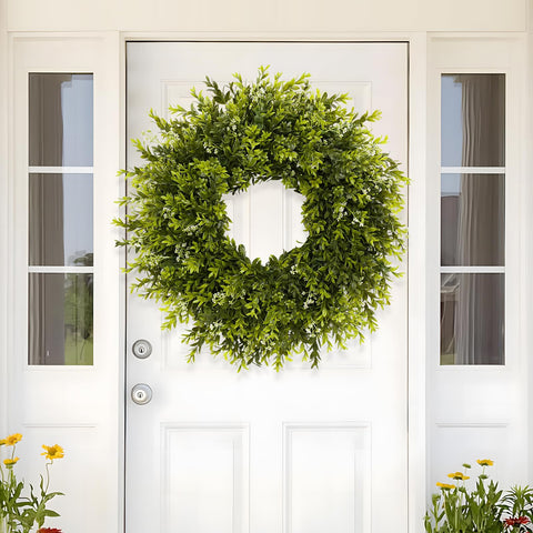 Chiyinbao boxwood wreath by the fireplace creates warm seasonal ambience