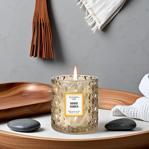 Elegant amber candle by Chloefu LAN as a decorative accent