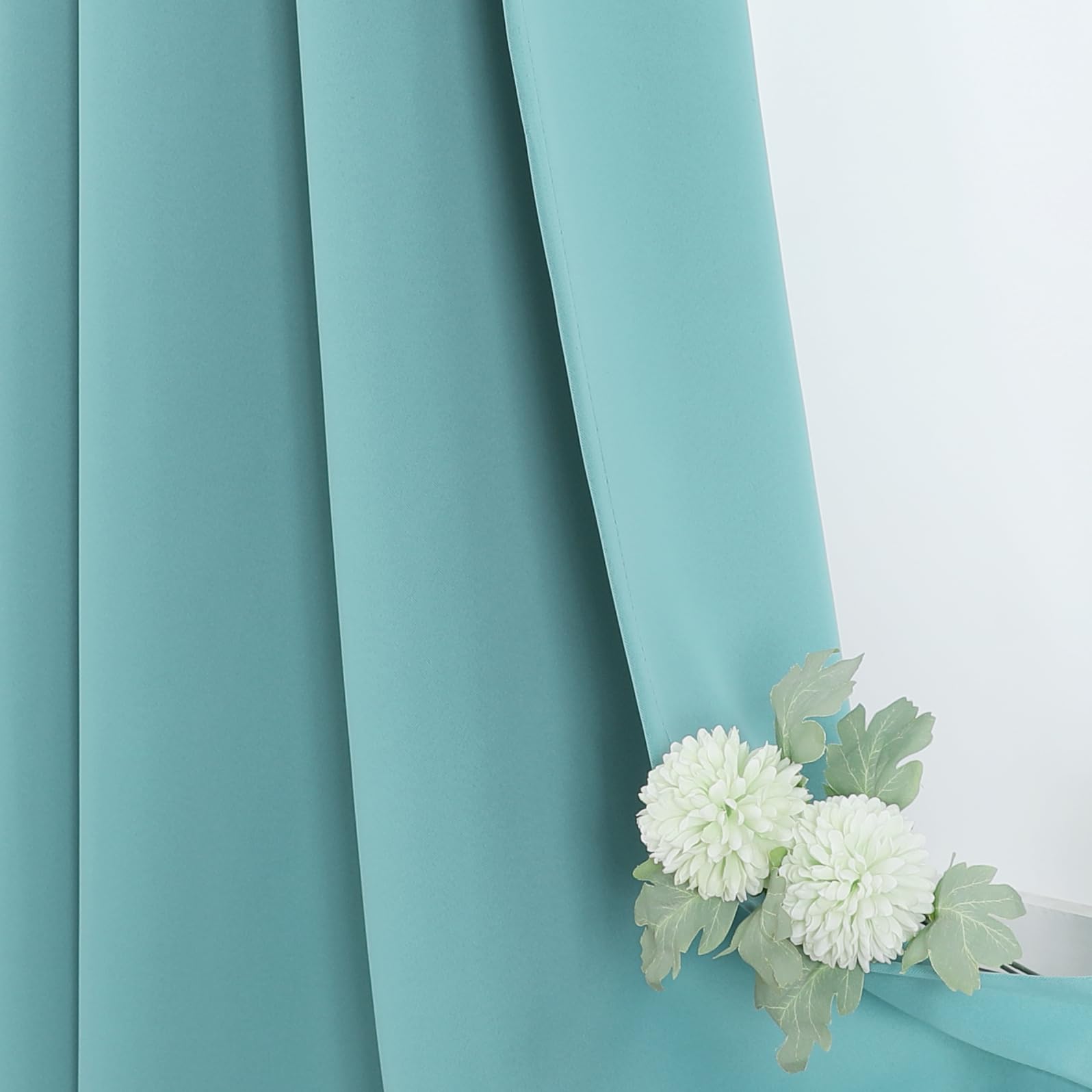 ChrisDowa Aqua blackout curtains in a nursery room setup for restful space