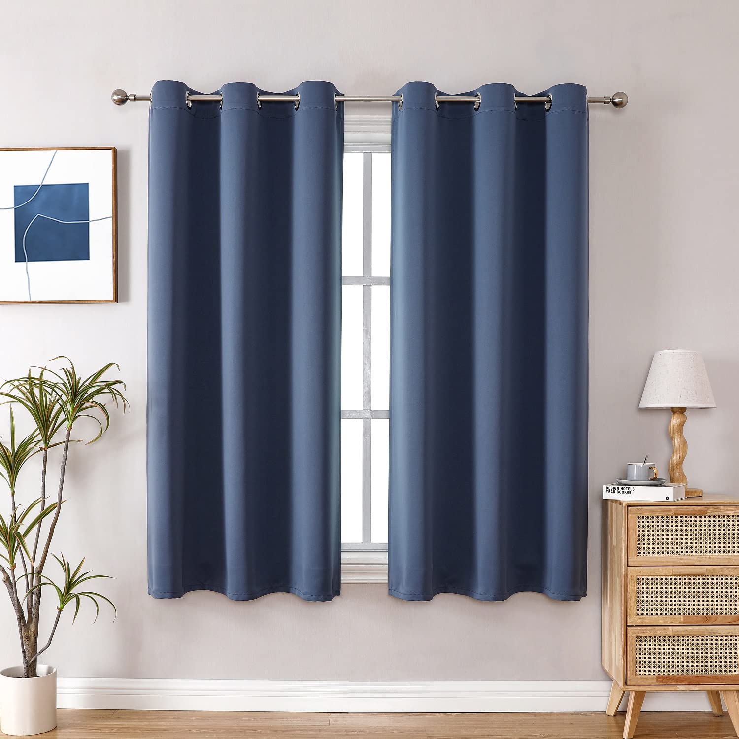 ChrisDowa grommet blackout curtains in stone blue blocking light for better rest
