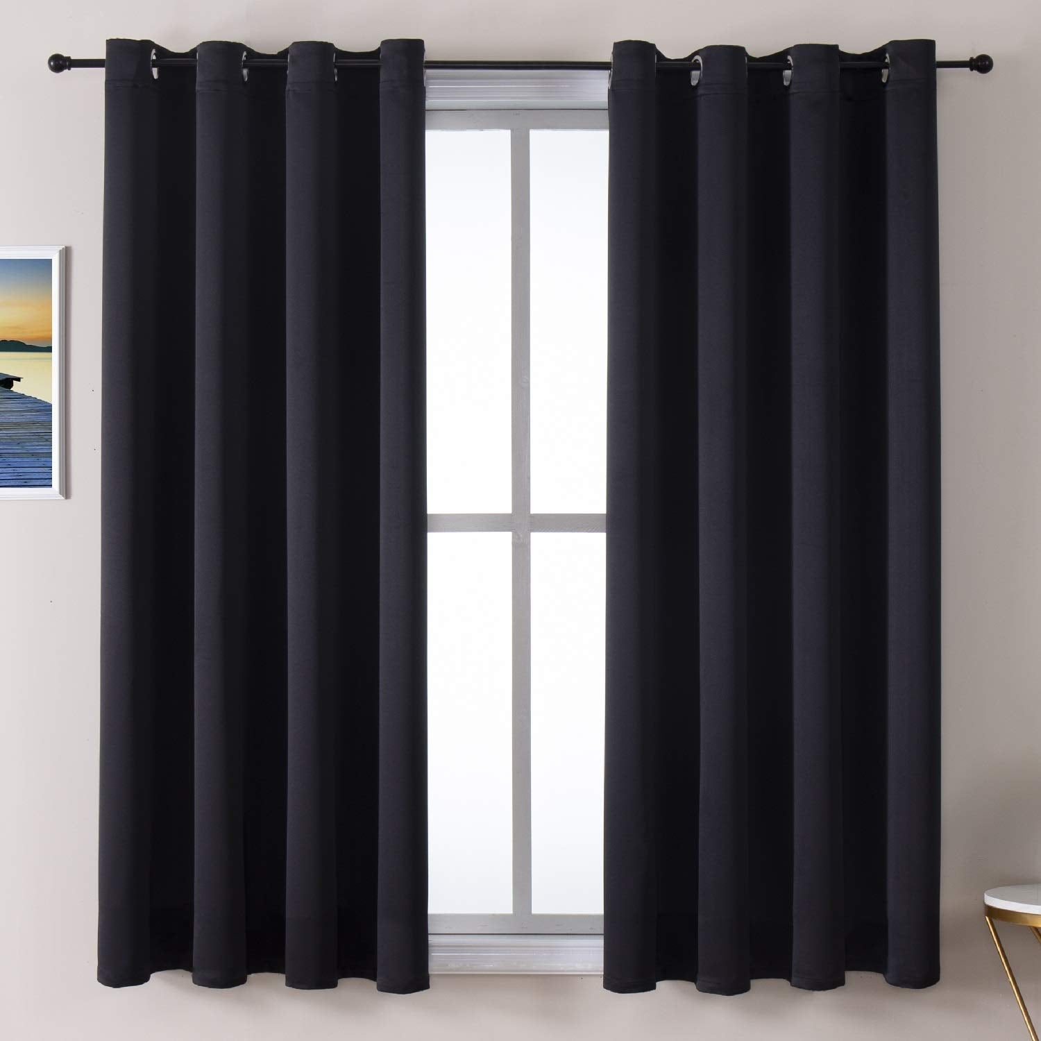 ChrisDowa grommet blackout curtains front view; two-panel design blocks daylight for better sleep.