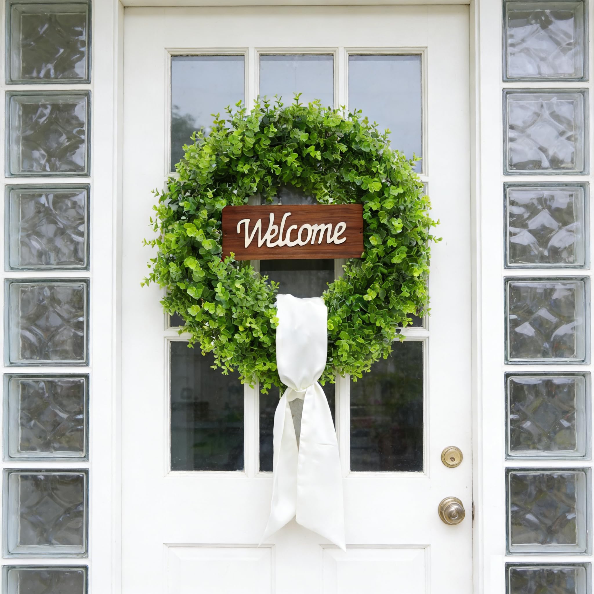Handcrafted leaves and vines on ChrisXiao wreath evoke fresh greenery all year
