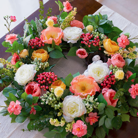 CHvista wreath featuring eucalyptus and blooms for lush outdoor entryways.