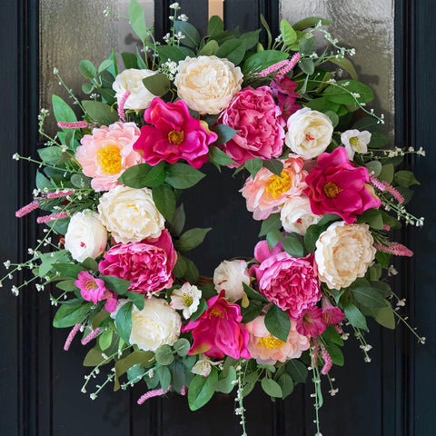 CHvista 24-inch spring wreath with peonies and magnolias enhances curb appeal.