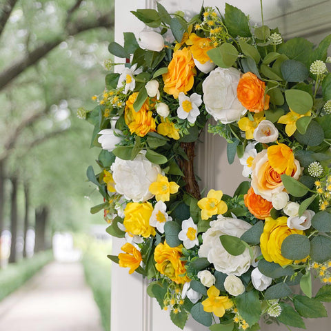 Daffodils and blossoms in CHvista wreath for seasonal charm.