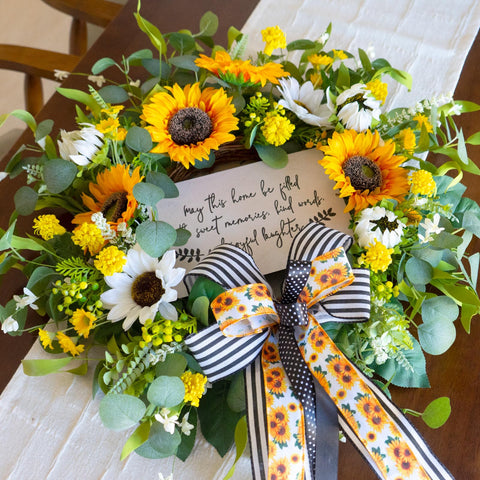 CHvista spring wreath showcasing an elegant bow for a refined entrance.