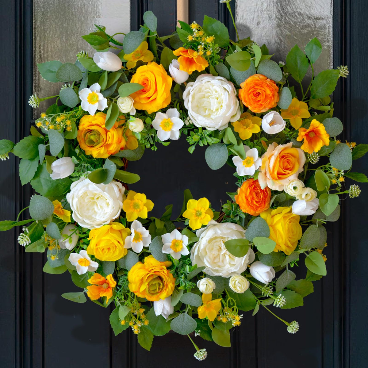 CHvista 24-inch spring wreath with yellow and white blooms brightening the entry.