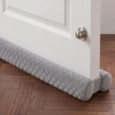 Ciieyuo premium velvet under-door draft stopper glides under doors to seal drafts.