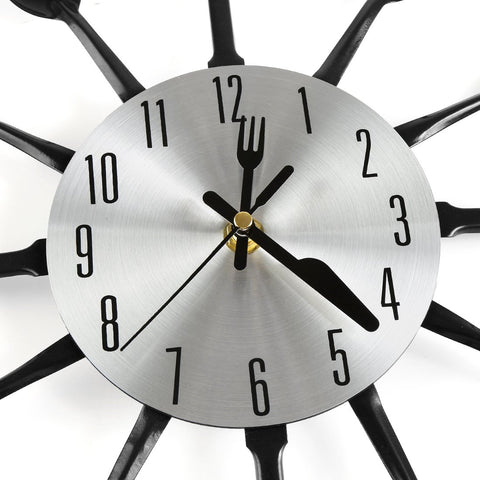 CIGERA clock shows fork and knife hour hands for a playful look.