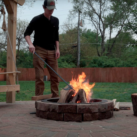 CKLT fire poker set at a campfire showing control of flames.