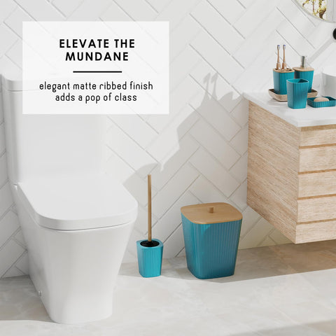 Clara Clark teal toilet brush and trash can keep bathrooms neat.