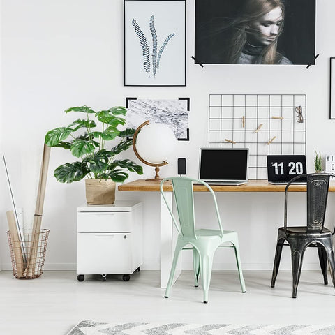 CLONG artificial monstera leaves in a backyard setting for year-round greenery