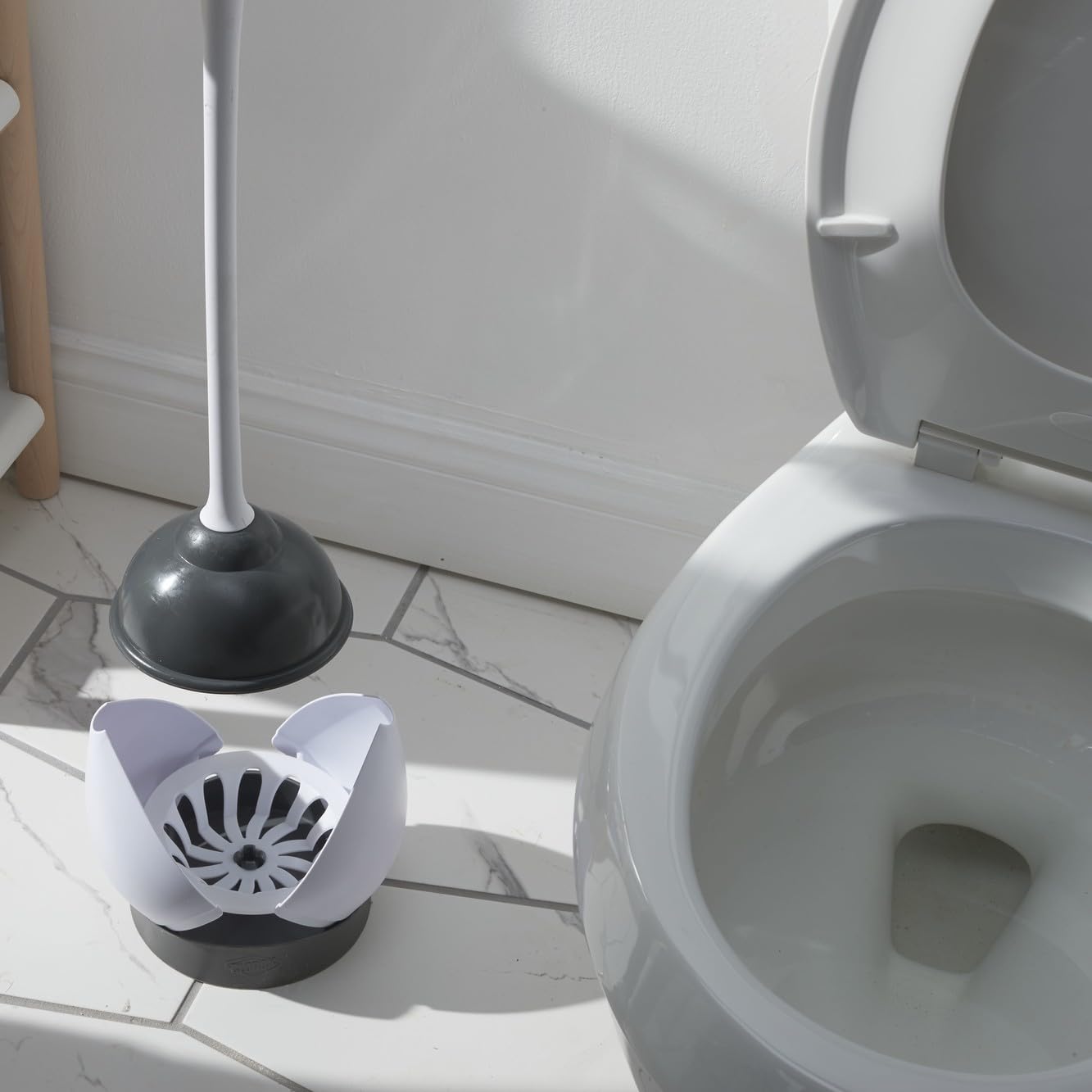 Clorox hideaway storage beside the toilet for easy access.