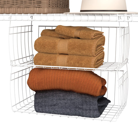 ClosetMaid Wire Hanging Basket in linen closet stores sheets neatly.