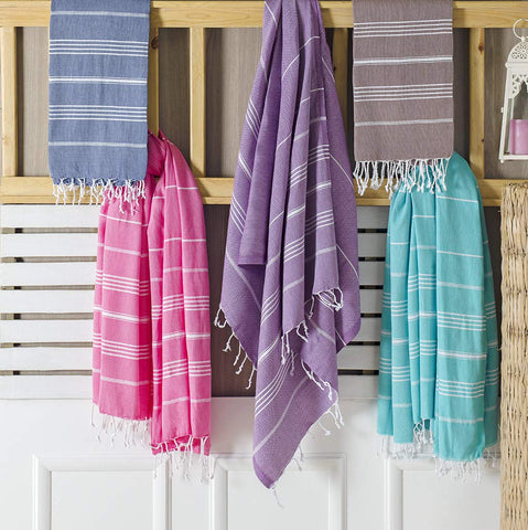 Clotho Made-in-Turkey beach towels in a travel-friendly set.