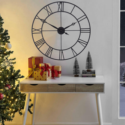 CLXEAST black metal clock serving as a striking focal decor piece.