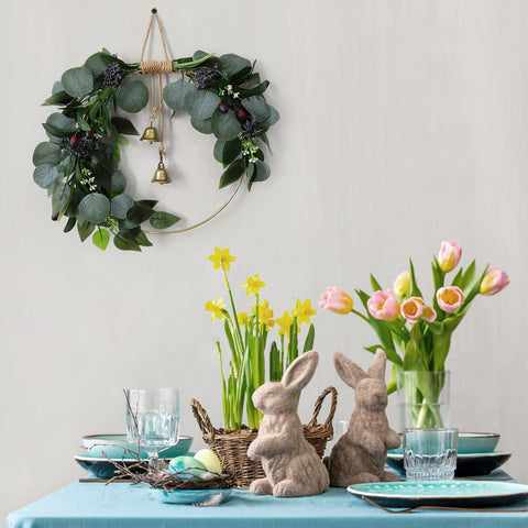 CMINAUS eucalyptus wreath hanging rope bell enhances rustic porch decor.