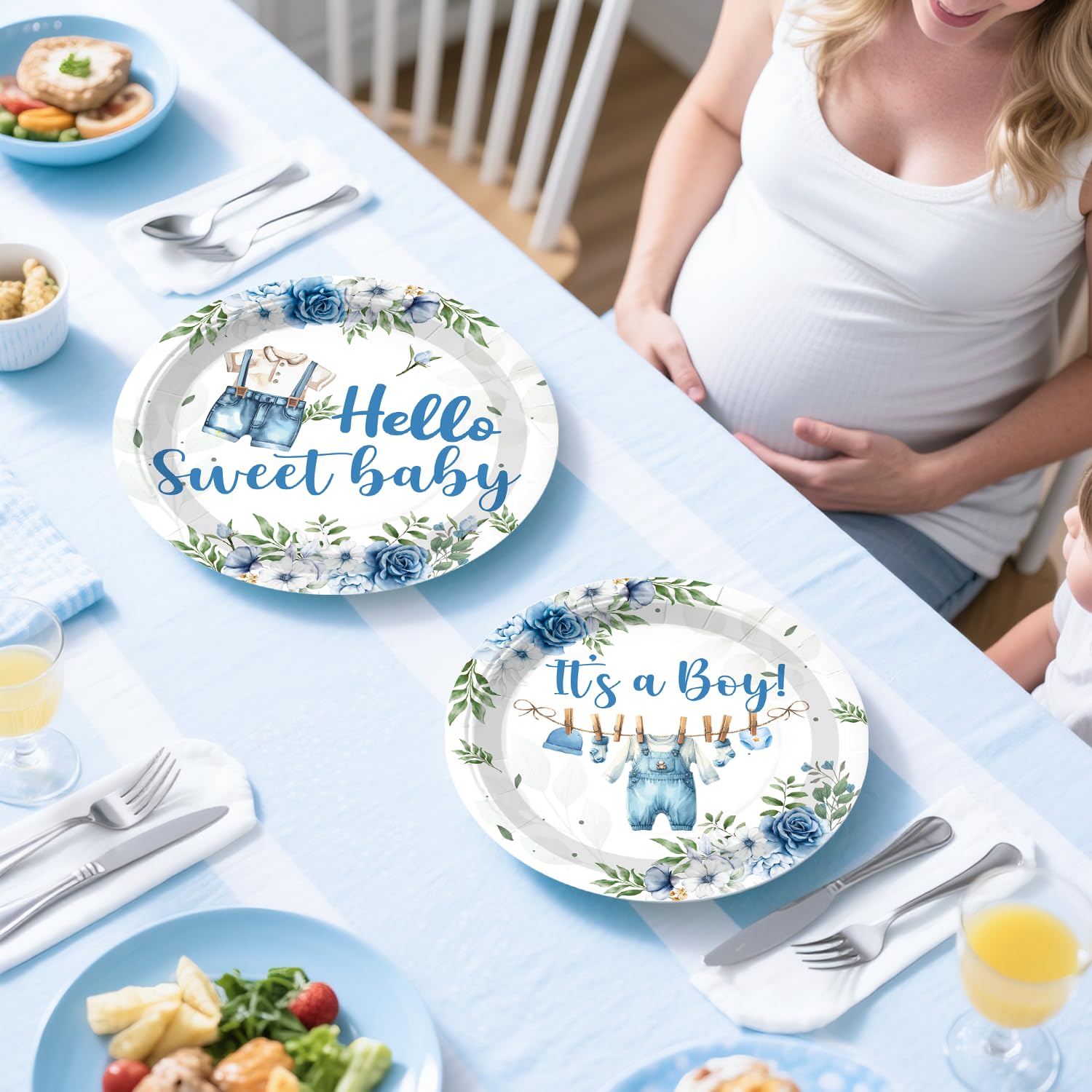 Cocomigo baby boy corsage complements the ensemble with a refined finish.