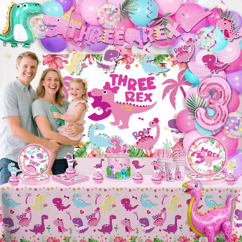 Cocomigo pink dinosaur cake topper crowns the birthday dessert.
