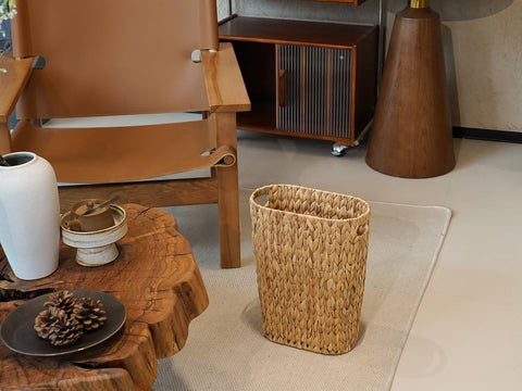 5-gallon capacity of the Coeusy wicker trash can in action