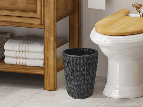 Coeusy wicker trash can with compact 11.02-inch height and 7.48-inch diameter.
