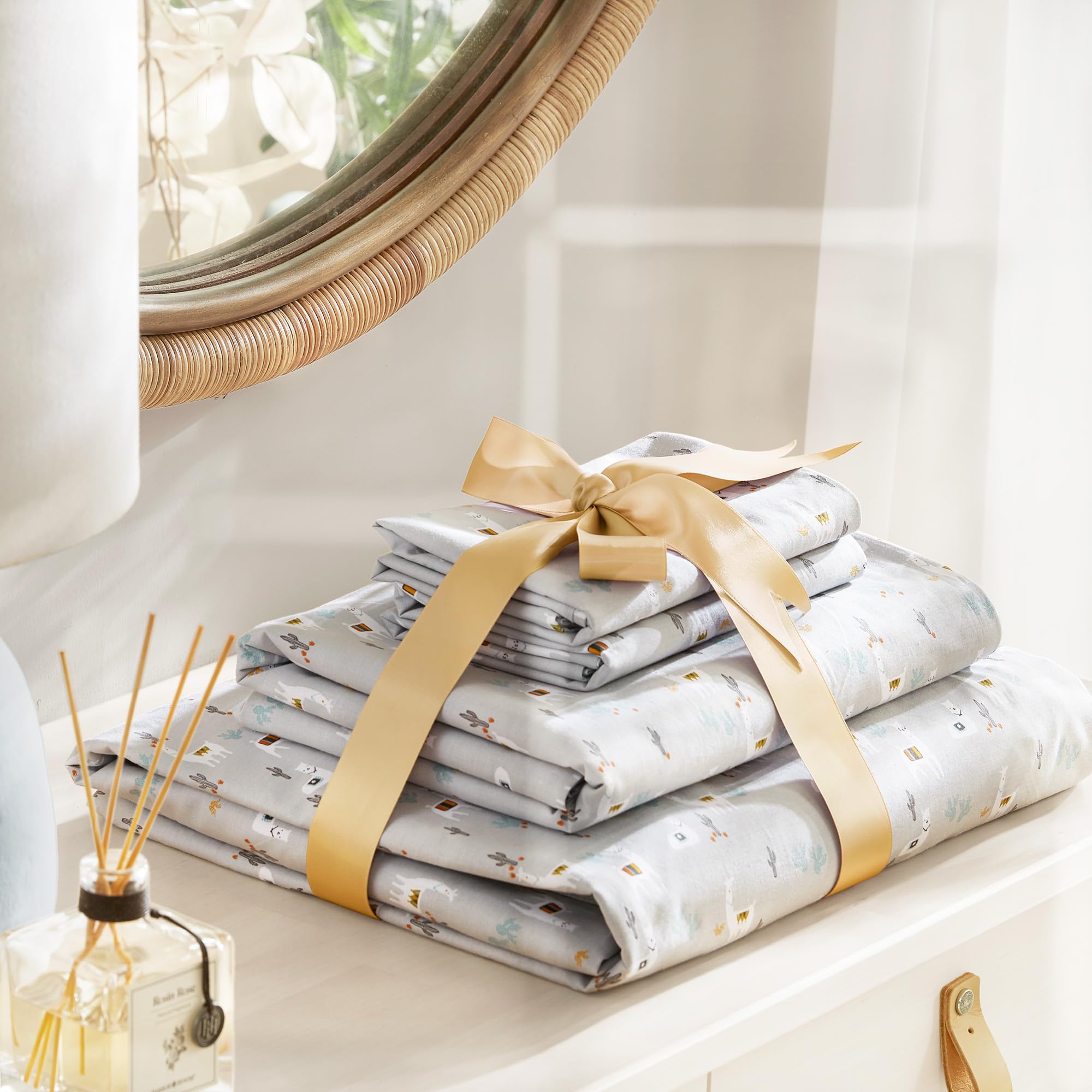 Comfort Spaces llama bedding on a bed with an all-season look