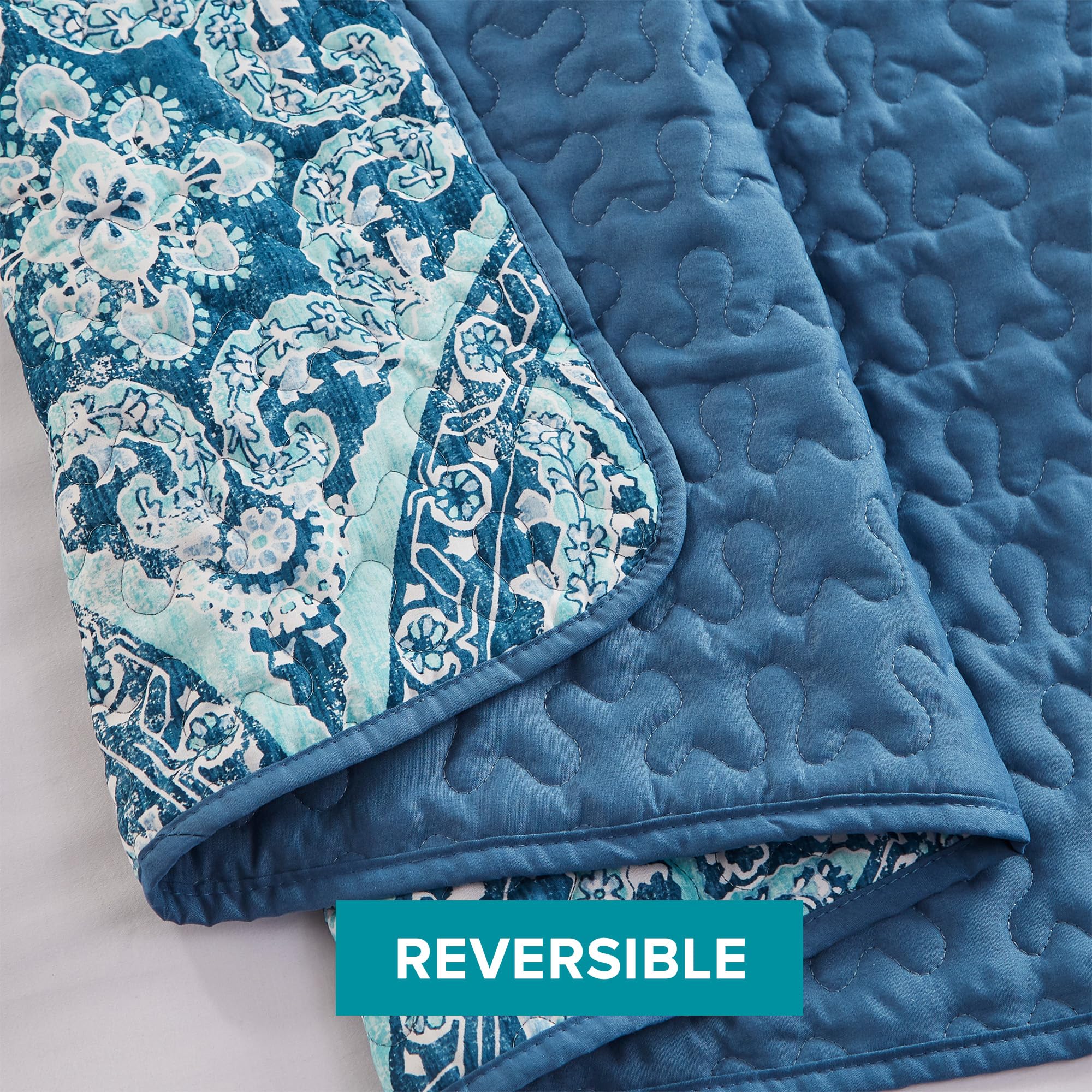 Bedroom setup featuring Gloria quilt on the bed with easy-care design