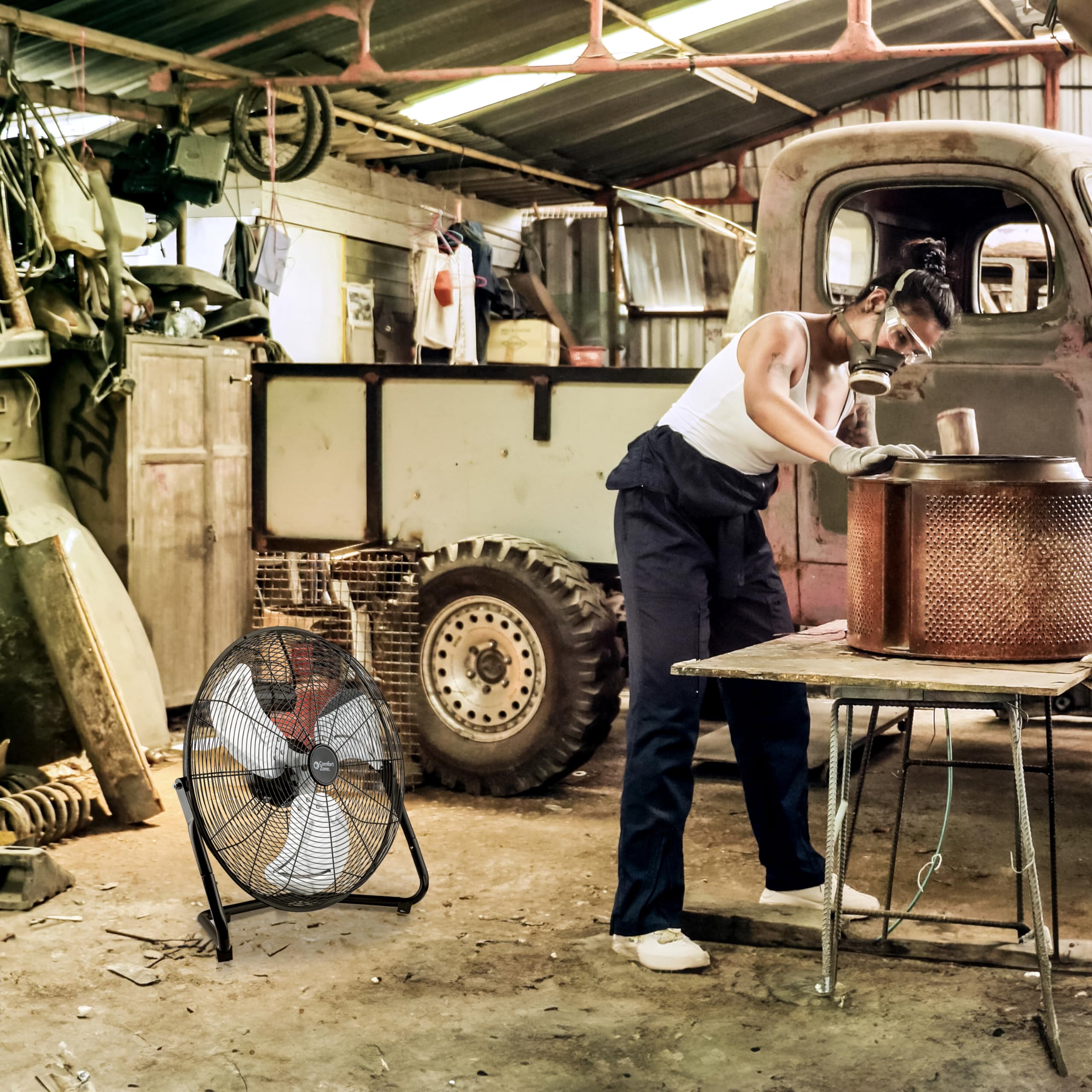 Comfort Zone fan in a workshop setting delivering broad-area cooling.