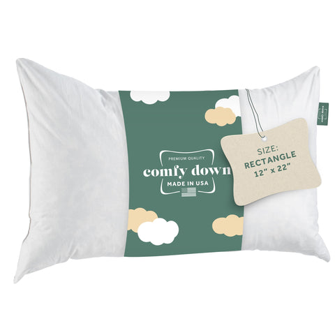 ComfyDown 12x20 throw pillow insert on bed shows plush support.