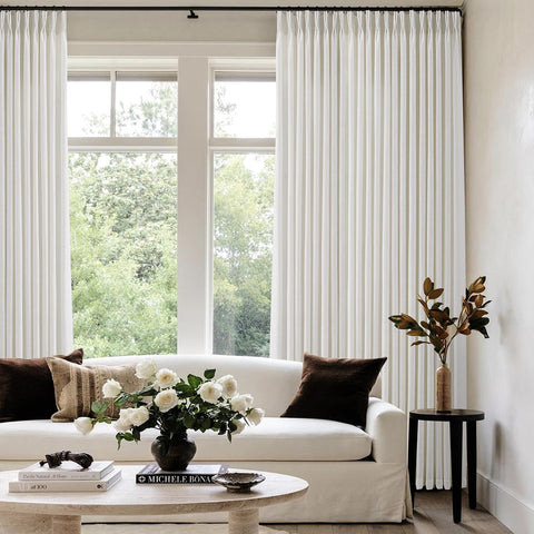 COMON HOME floor-to-ceiling curtains create a lofty, airy atmosphere