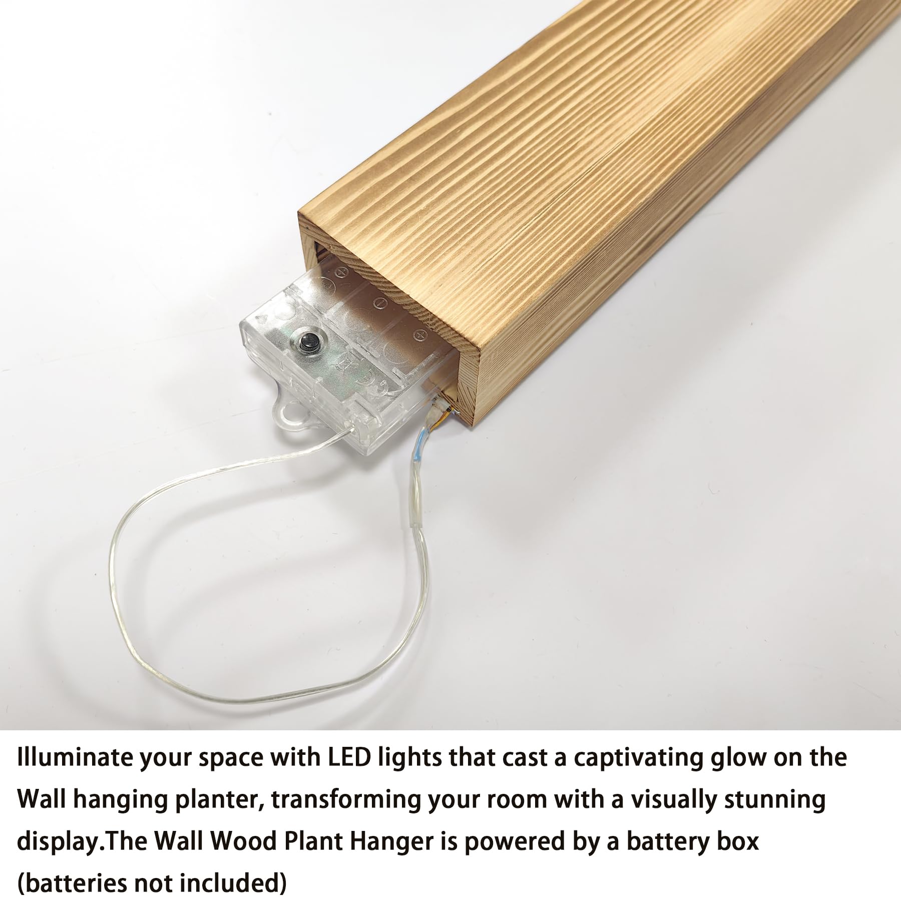 Comtelek LED wall planter with faux eucalyptus helps create cohesive, inviting living room decor.
