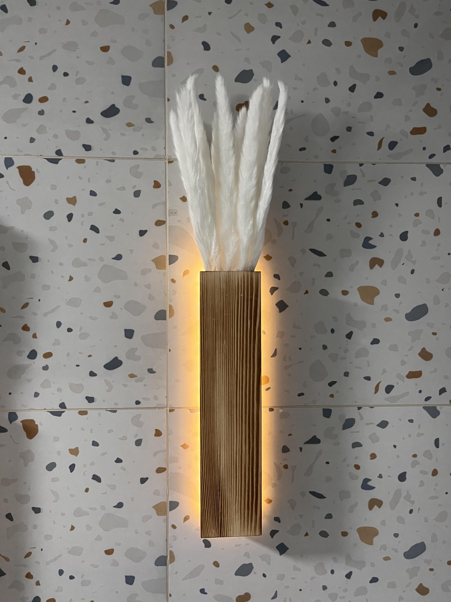 Comtelek wall sconce planters provide decorative framing for dried or artificial arrangements.