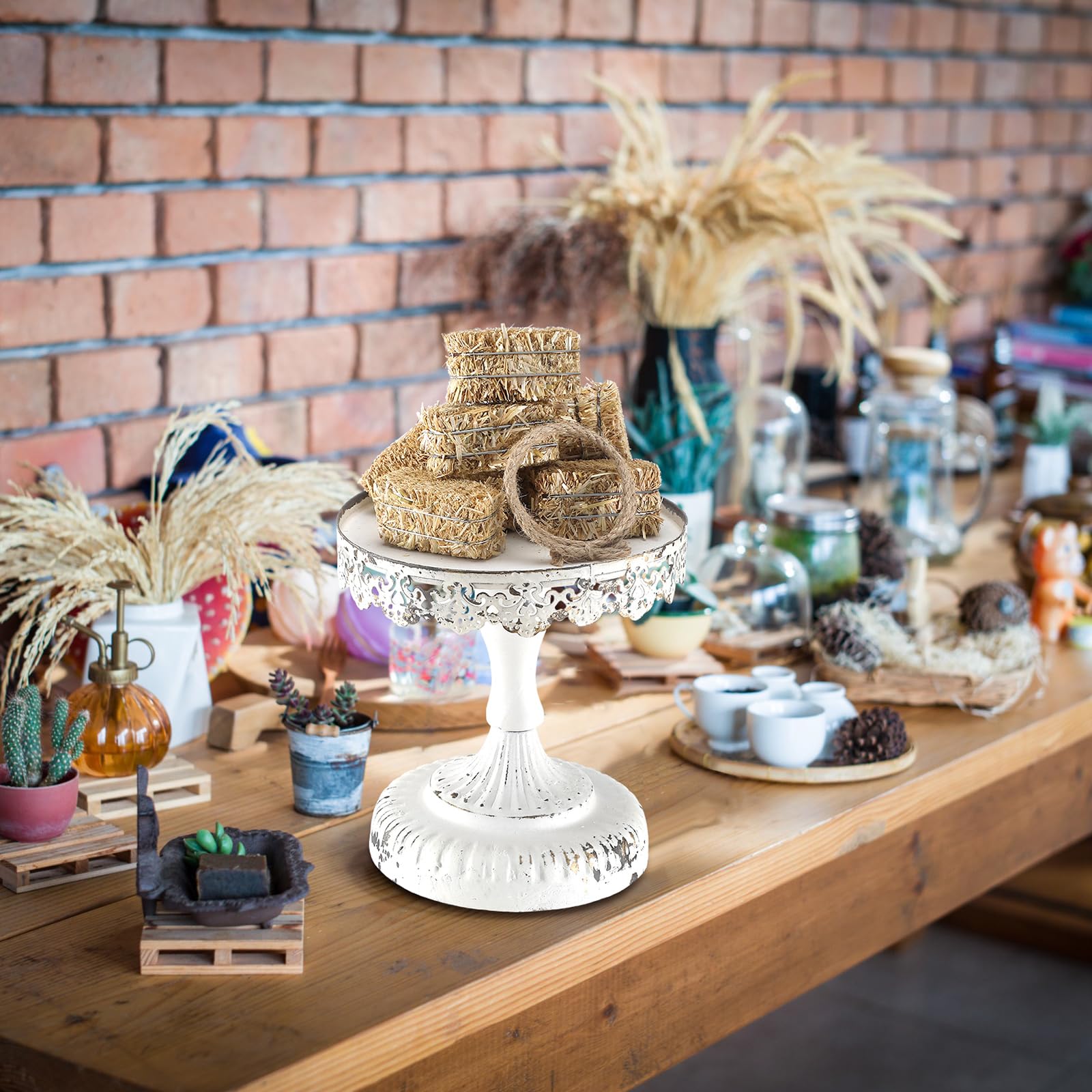 Conelist western party centerpiece display featuring small bales and rope accents.