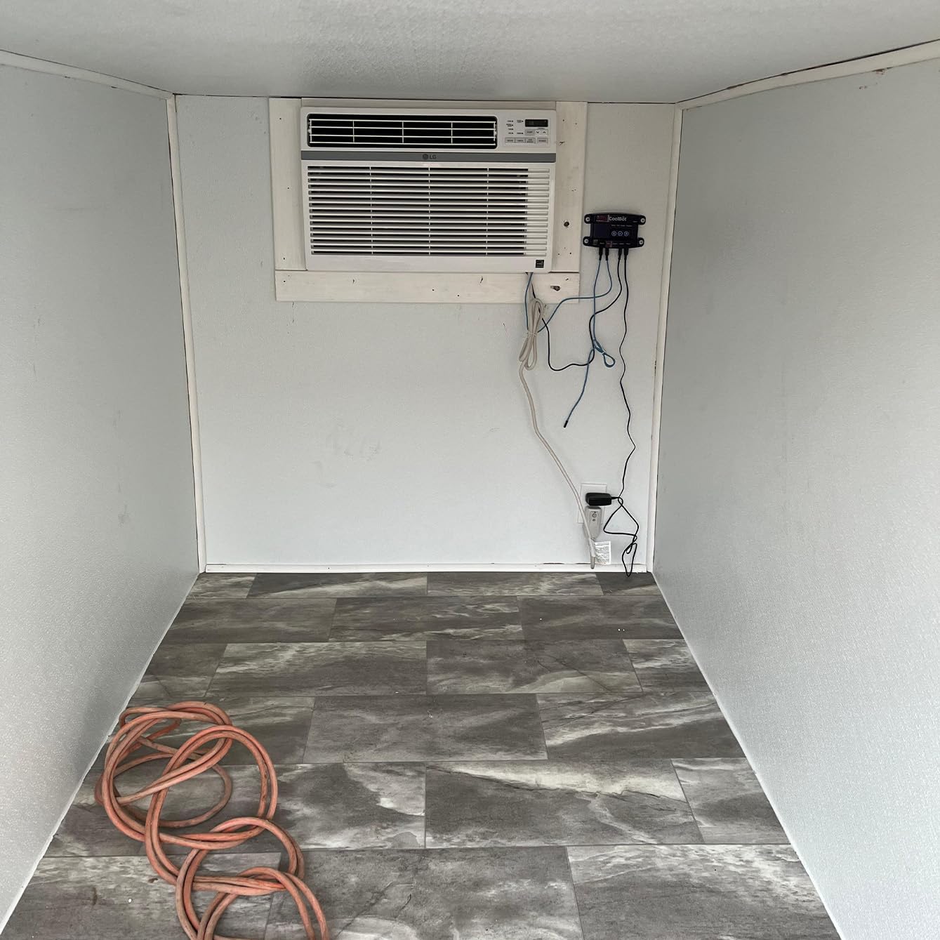 Insulated room with CoolBot Pro creating a walk-in cooler for produce storage