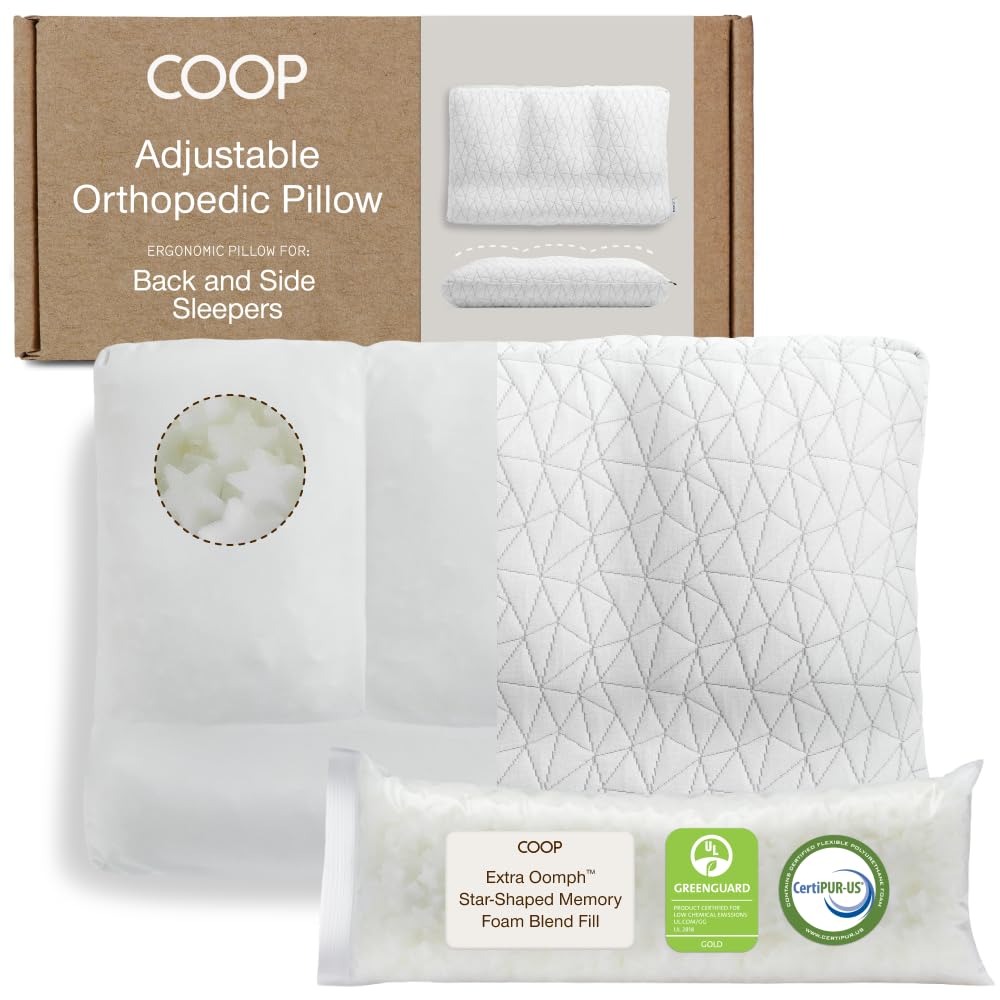 Coop Home Goods adjustable orthopedic pillow front view on bed, showcasing customizable support for all sleep positions