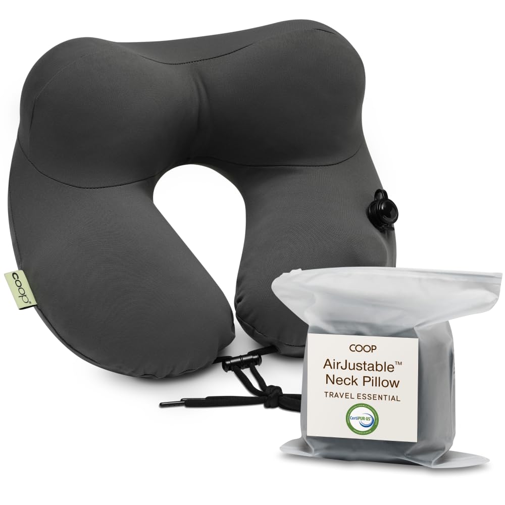 Coop Home Goods AirJustable neck pillow inflated for personalized head and neck support on flights.