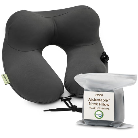 Coop Home Goods AirJustable neck pillow inflated for personalized head and neck support on flights.
