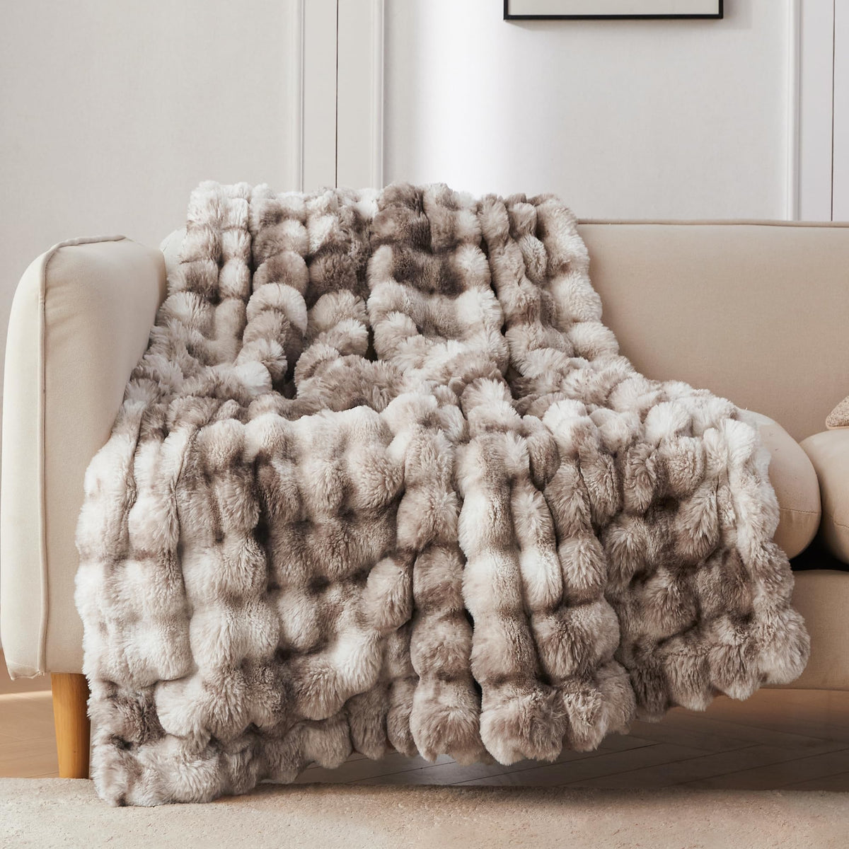 COOVA faux fur throw 50x60 on couch for cozy warmth.