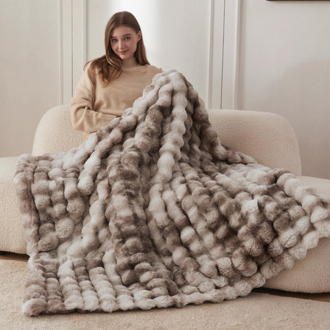 COOVA bubble-pattern brown faux fur throw adds luxury texture to living room.