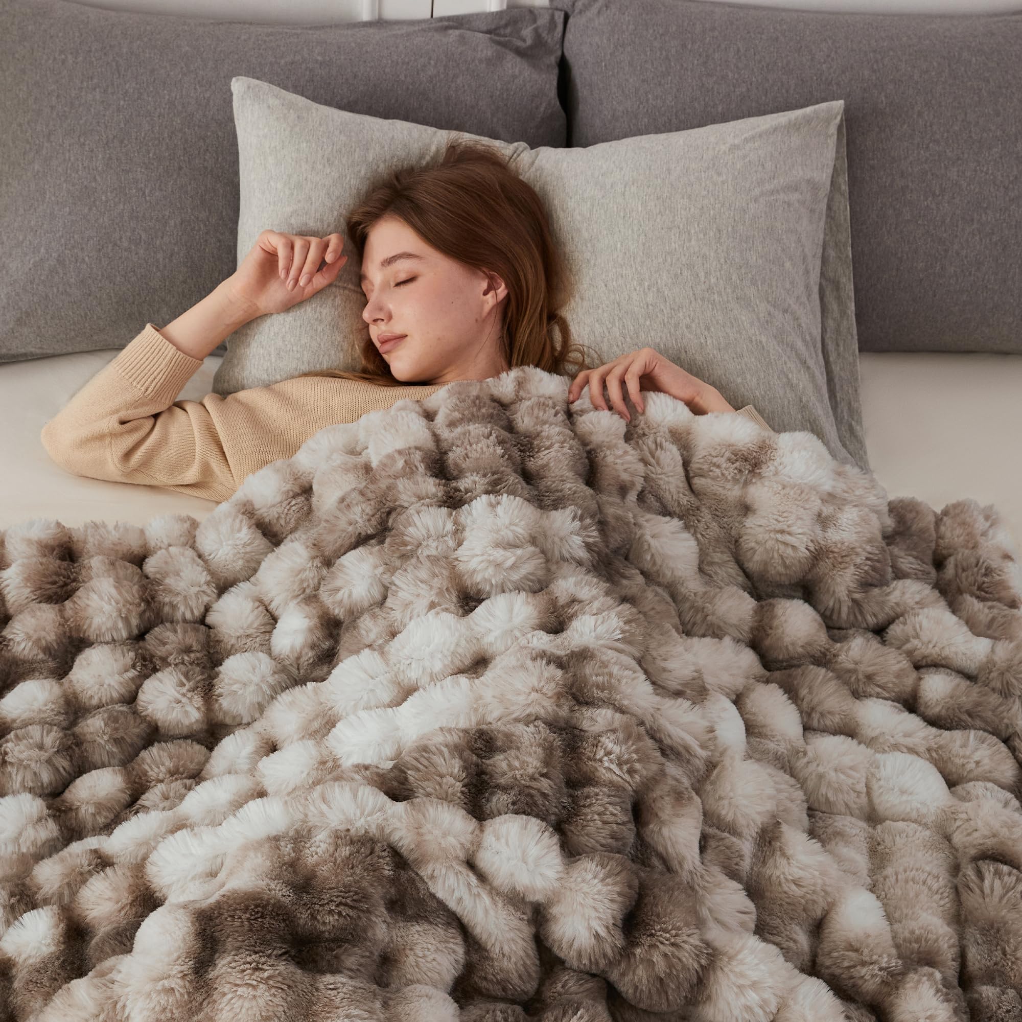COOVA faux fur throw on sofa shows luxurious texture and inviting comfort