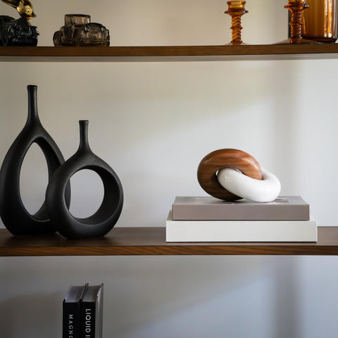 Knot decor on a shelf enhances living room styling